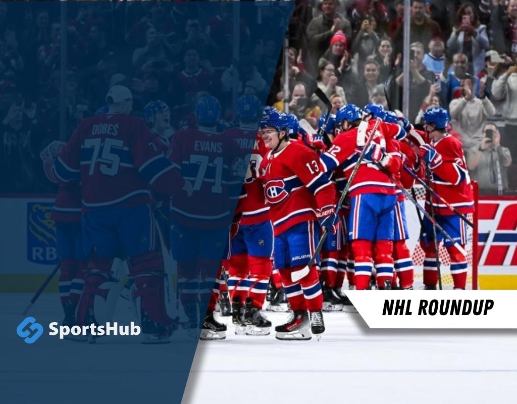 A group of hockey players in red jerseys celebrate a goal on the ice, with fans cheering in the background at an NHL game.