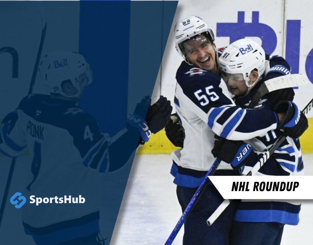 Two hockey players in blue and white uniforms celebrate an on-ice achievement. A logo and text "NHL Roundup" are featured on the side.